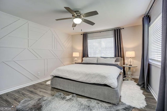 bedroom with ceiling fan and wood-type flooring