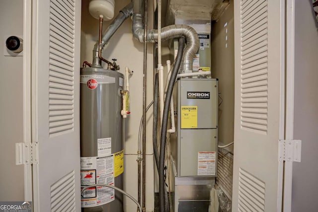 utility room featuring gas water heater