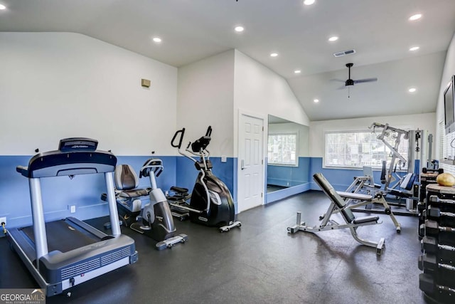 exercise room with ceiling fan and lofted ceiling