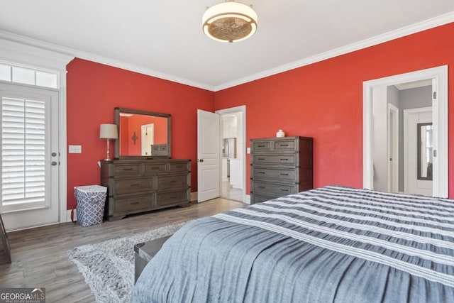 bedroom featuring light hardwood / wood-style floors and ornamental molding