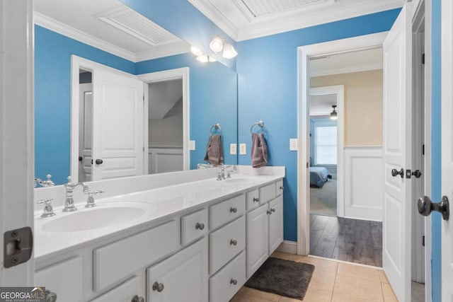 bathroom featuring vanity, hardwood / wood-style flooring, and ornamental molding