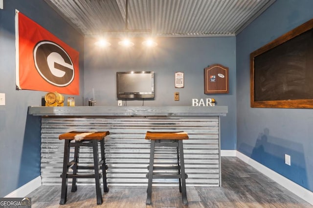 bar featuring dark hardwood / wood-style floors