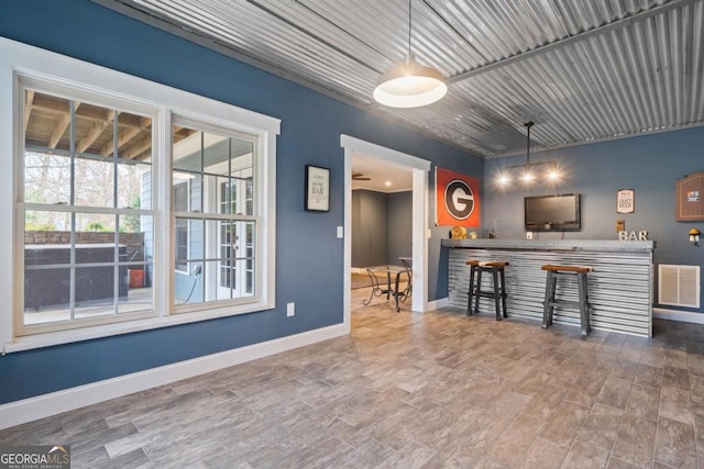 kitchen featuring wood-type flooring and hanging light fixtures