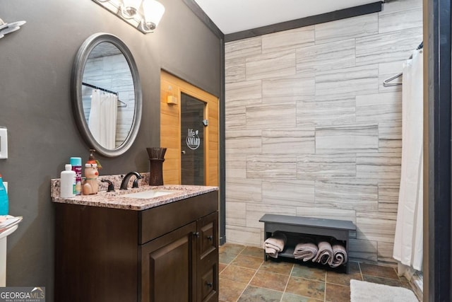 bathroom with a shower with shower curtain and vanity