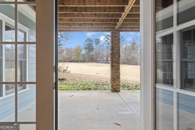 doorway to outside featuring concrete flooring