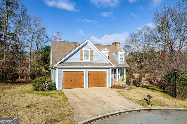 view of front facade featuring a front yard and a garage