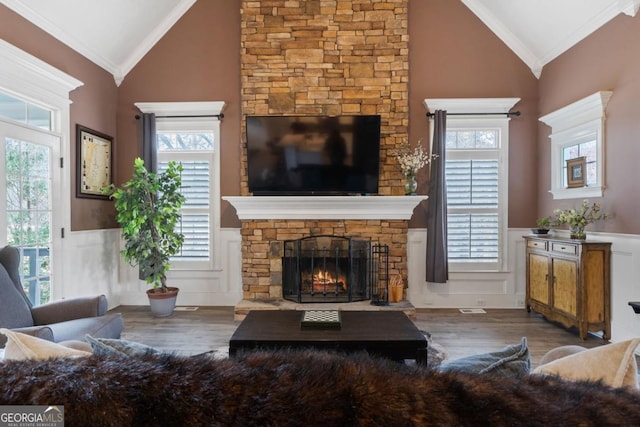 living room with a wealth of natural light and ornamental molding