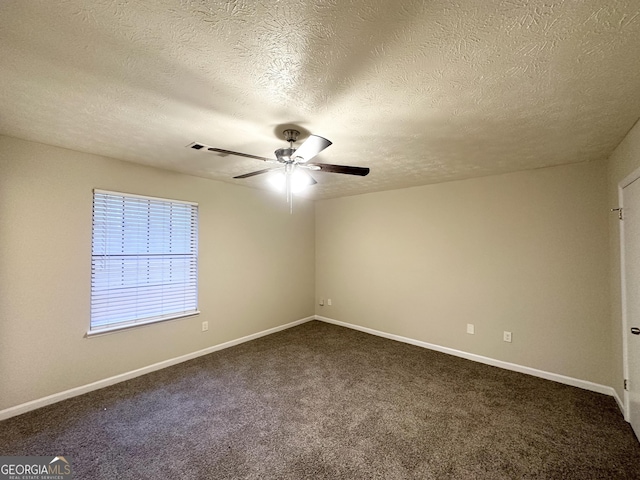 carpeted empty room with a textured ceiling and ceiling fan