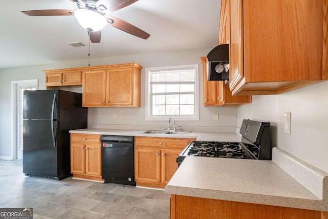 kitchen featuring sink, ceiling fan, and black appliances