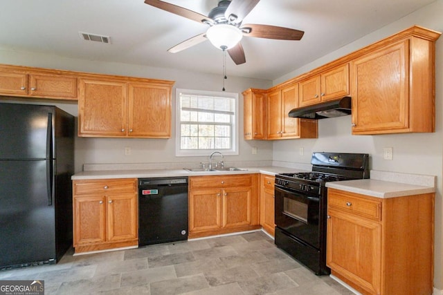 kitchen featuring ceiling fan, sink, and black appliances