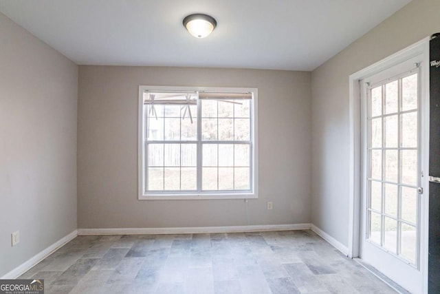 spare room featuring a healthy amount of sunlight