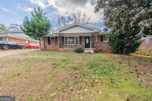 ranch-style house with a porch and a front yard