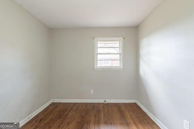 spare room featuring hardwood / wood-style floors