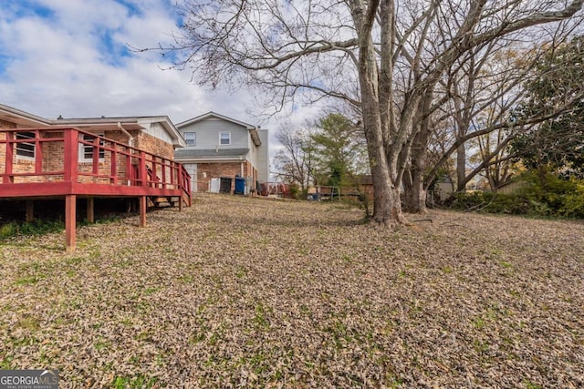 view of yard with a deck