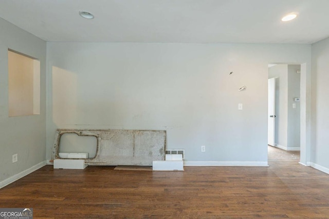 unfurnished room featuring dark hardwood / wood-style floors