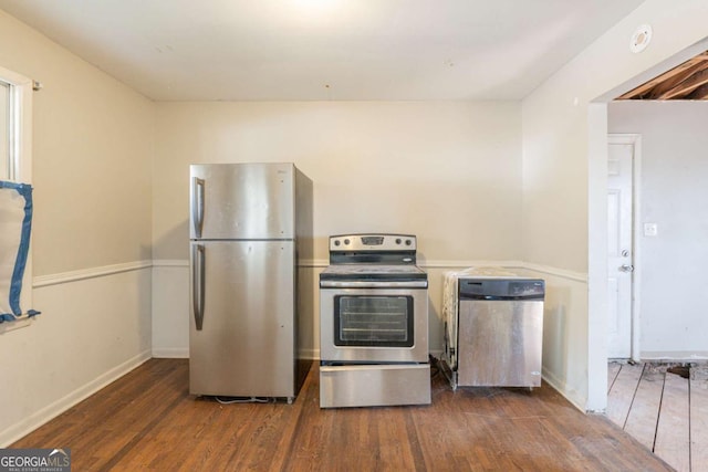 kitchen featuring dark wood-type flooring and appliances with stainless steel finishes