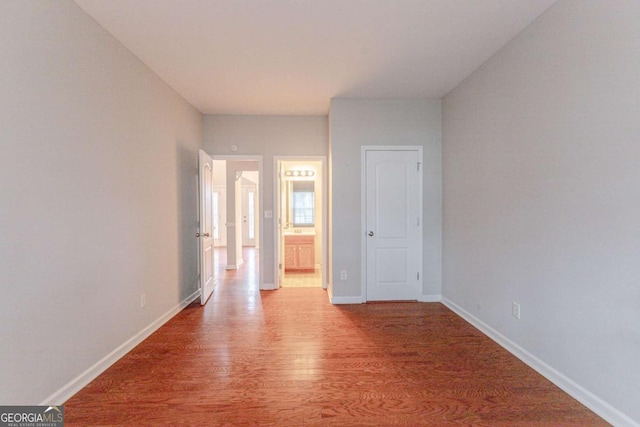 spare room with hardwood / wood-style floors