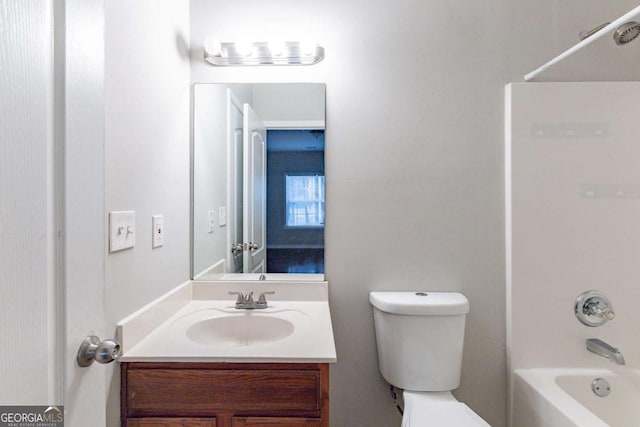 full bathroom featuring vanity, bathtub / shower combination, and toilet