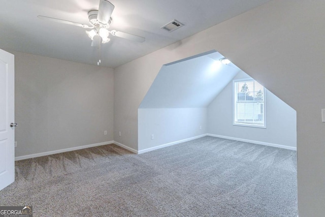 additional living space with carpet, ceiling fan, and lofted ceiling