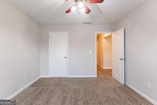 unfurnished bedroom with carpet and ceiling fan