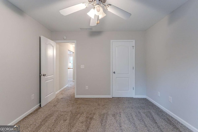 unfurnished bedroom with carpet flooring and ceiling fan