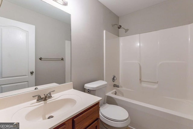 full bathroom with vanity, tub / shower combination, and toilet