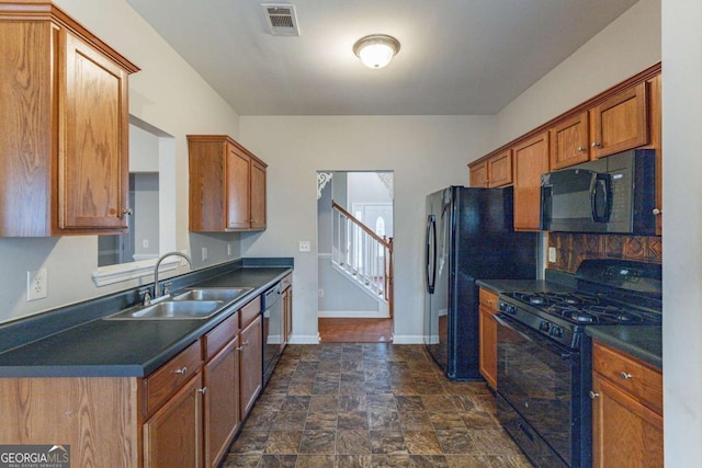 kitchen featuring sink and black appliances