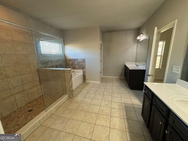 bathroom with tile patterned floors, vanity, and independent shower and bath