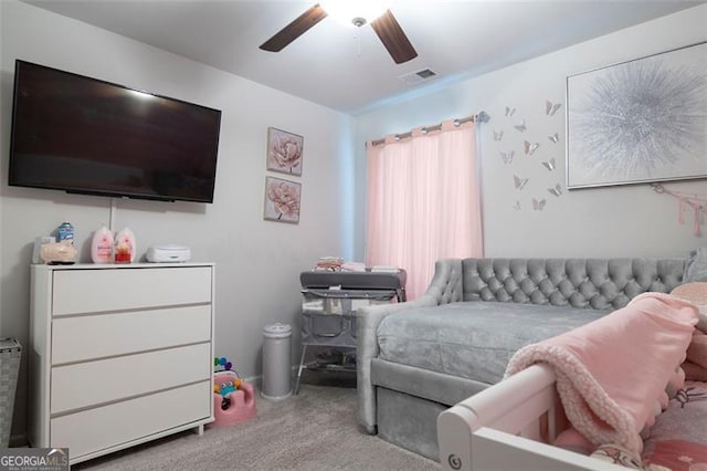 bedroom with ceiling fan and light carpet