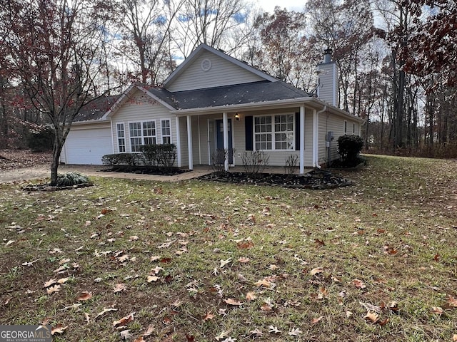 view of front of property with a garage and a front yard