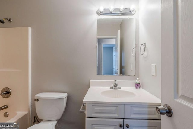 full bathroom with bathtub / shower combination, vanity, and toilet