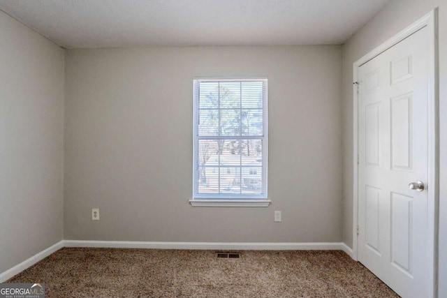 view of carpeted spare room