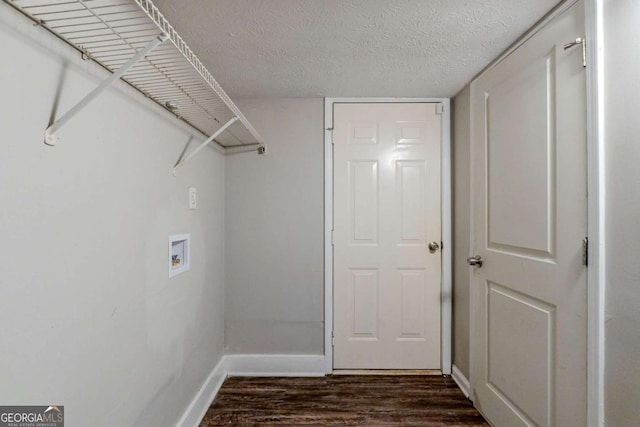 clothes washing area featuring hookup for a washing machine, dark wood-type flooring, and a textured ceiling