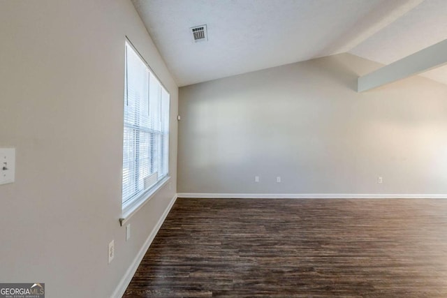 unfurnished room with dark hardwood / wood-style floors and lofted ceiling