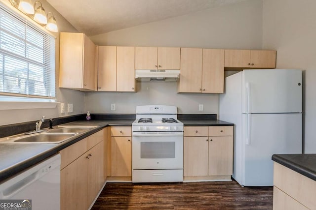 kitchen with light brown cabinets, white appliances, sink, vaulted ceiling, and dark hardwood / wood-style flooring