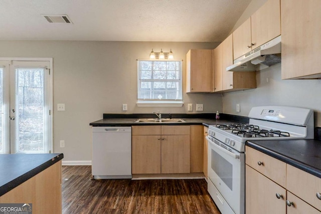 kitchen with dark hardwood / wood-style flooring, white appliances, light brown cabinets, and sink