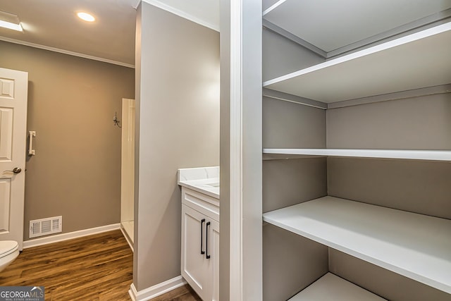 3625 Pointer Rd, Loganville, GA 30052 - washroom featuring dark wood finished floors, baseboards, recessed lighting, and ornamental molding