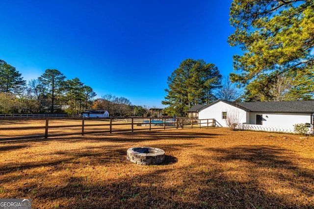 3625 Pointer Rd, Loganville, GA 30052 - view of yard with an outdoor fire pit