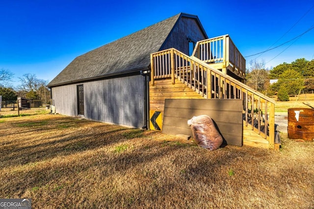 3625 Pointer Rd, Loganville, GA 30052 - view of property exterior with a shingled roof, stairway, a lawn, and a wooden deck