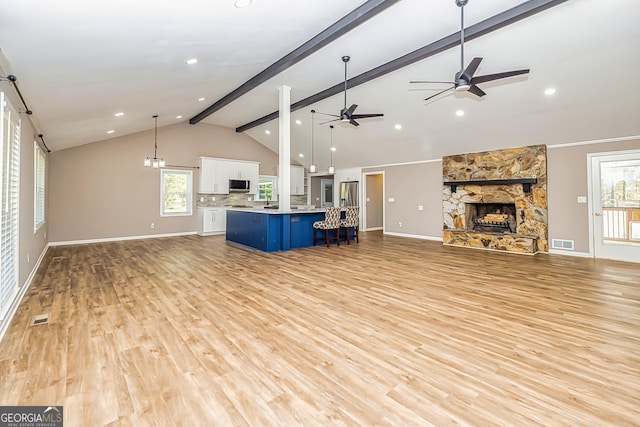 3625 Pointer Rd, Loganville, GA 30052 - unfurnished living room with ceiling fan, light wood-style floors, baseboards, a fireplace, and recessed lighting