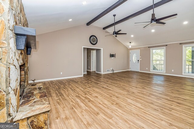 3625 Pointer Rd, Loganville, GA 30052 - unfurnished living room featuring ceiling fan, beamed ceiling, wood finished floors, recessed lighting, and high vaulted ceiling