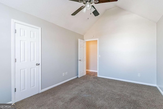 unfurnished bedroom with ceiling fan, carpet, and high vaulted ceiling