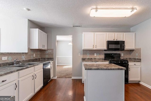 kitchen featuring a center island, black appliances, white cabinets, sink, and dark hardwood / wood-style flooring