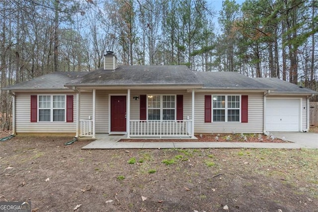 ranch-style home with covered porch and a garage