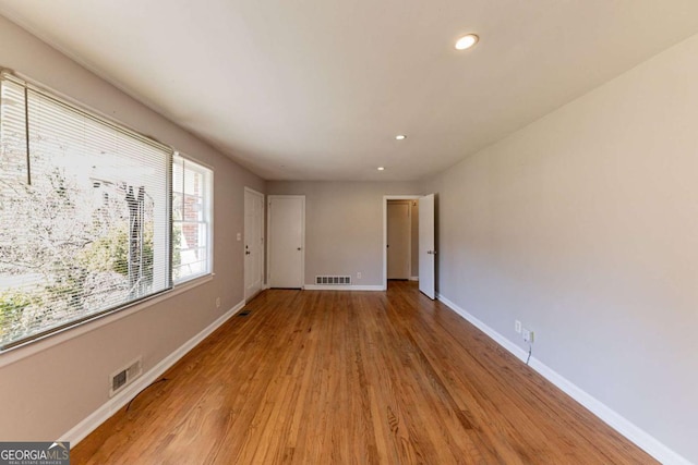 spare room featuring light hardwood / wood-style flooring