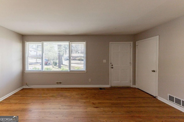 spare room featuring hardwood / wood-style flooring