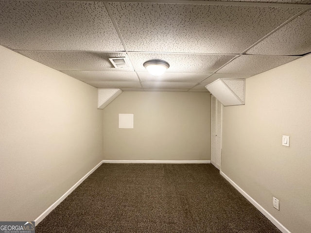 bonus room with dark colored carpet