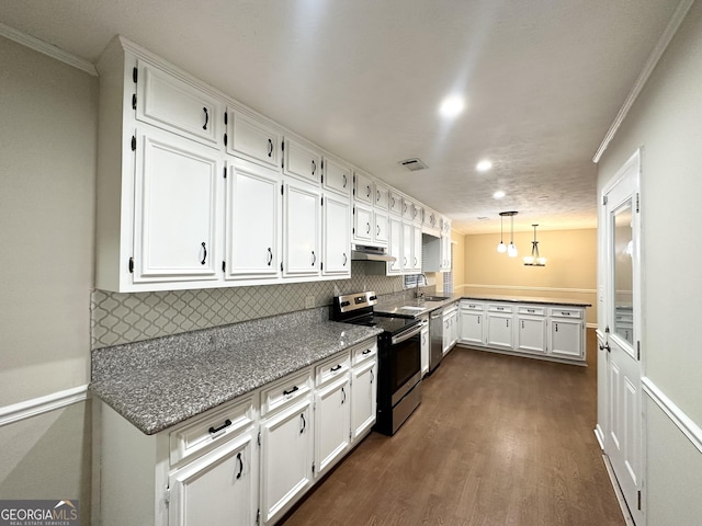 kitchen with appliances with stainless steel finishes, dark hardwood / wood-style flooring, crown molding, white cabinetry, and hanging light fixtures