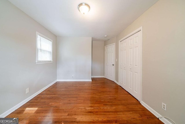 unfurnished bedroom featuring hardwood / wood-style floors