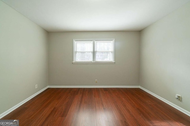 empty room featuring dark hardwood / wood-style floors